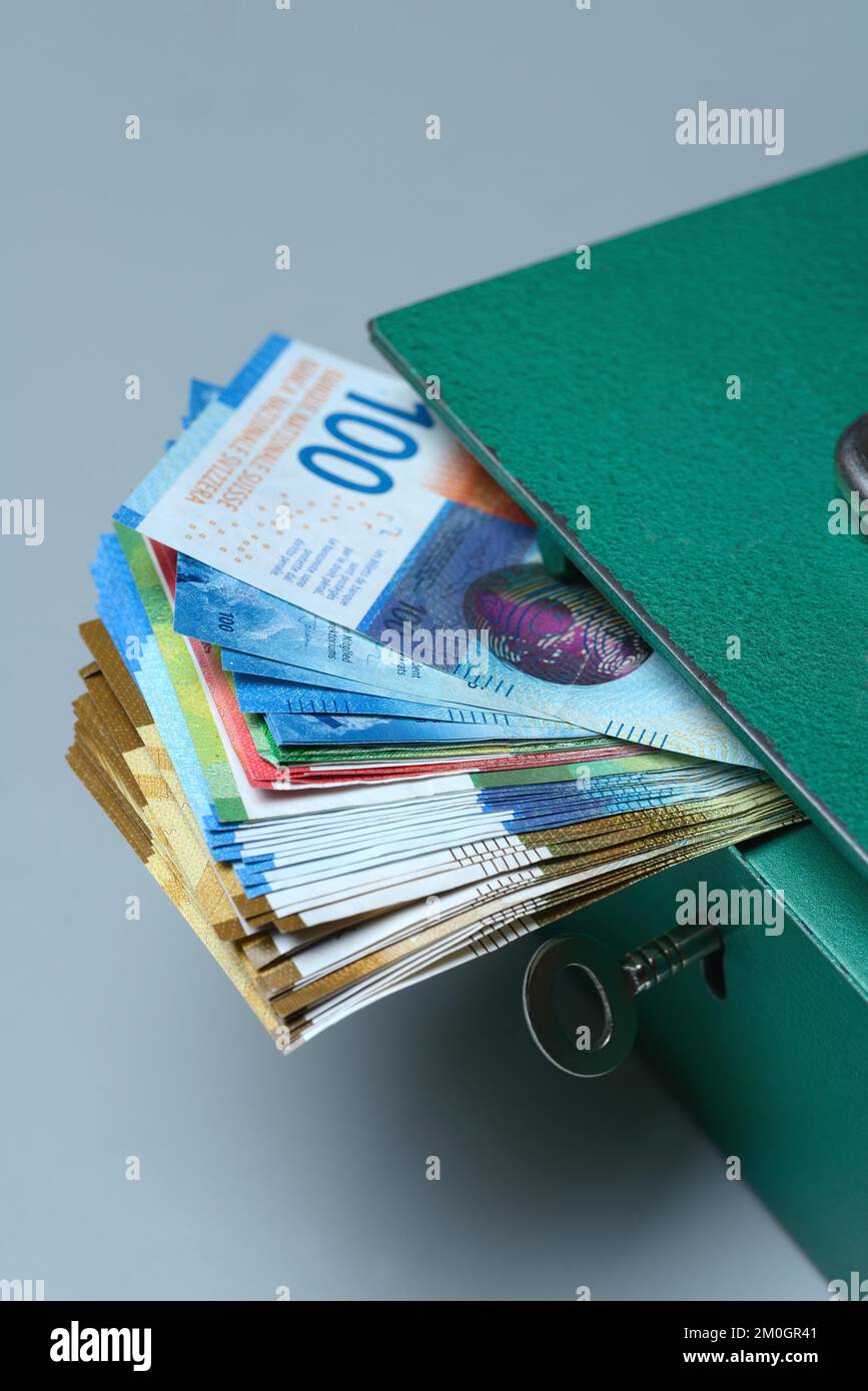 Cash box and Swiss banknotes, money, banknotes Stock Photo