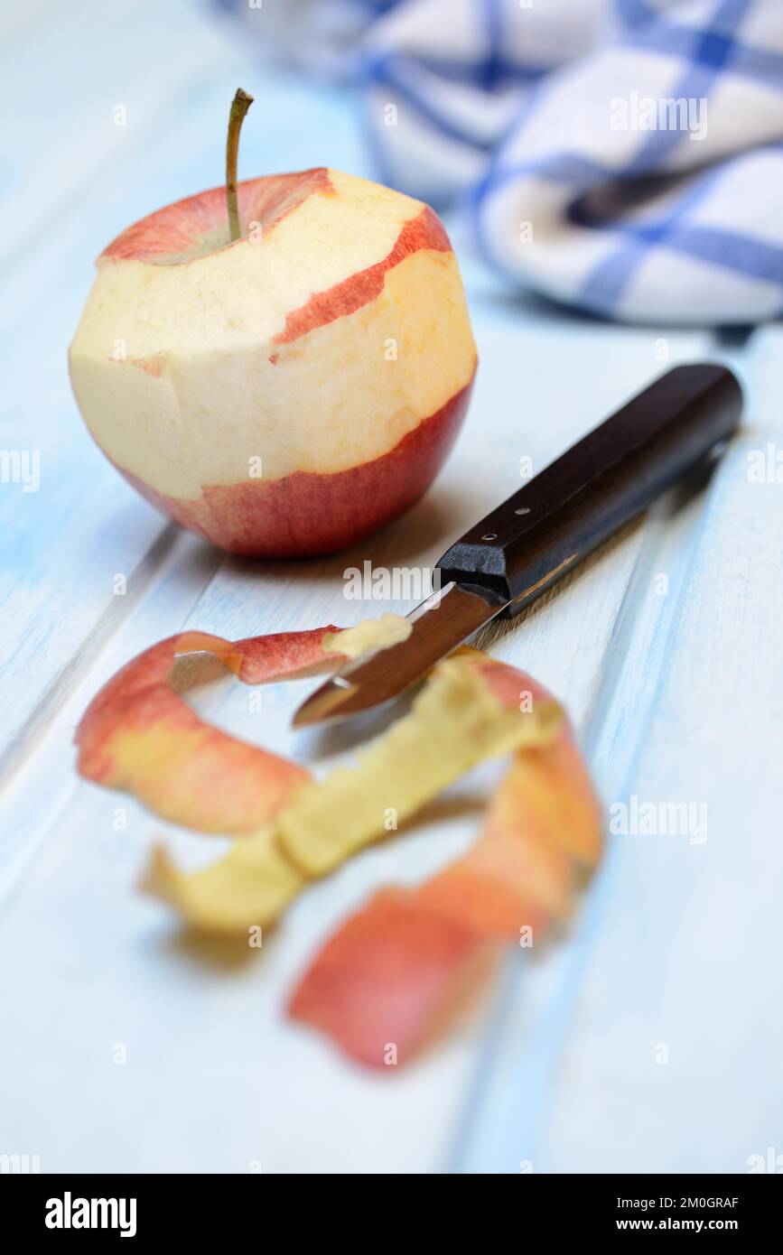 Peeled apple with peeling knife, apple peels Stock Photo Alamy
