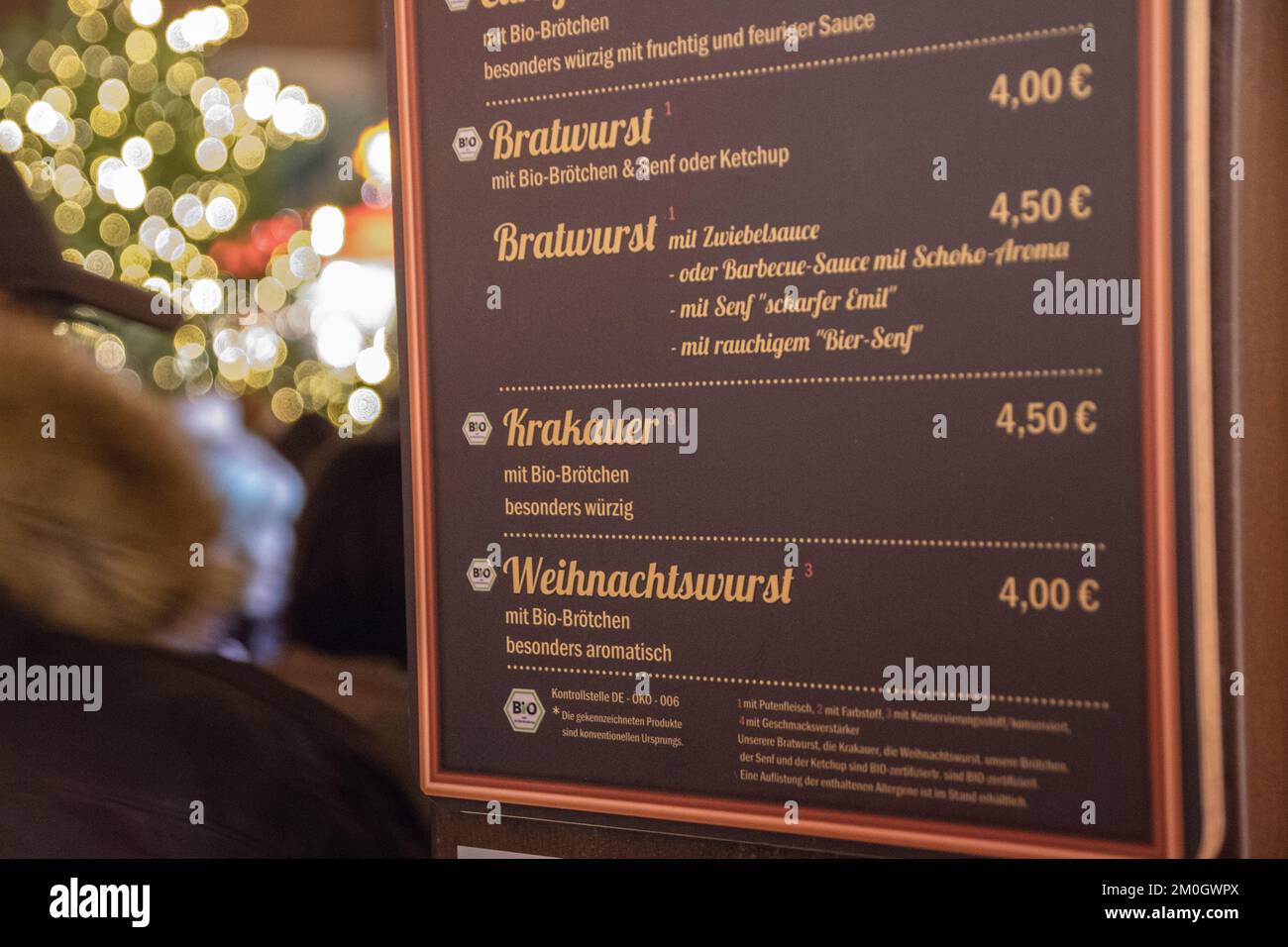 Cologne, Germany. 05th Dec, 2022. A price tag for various sausage dishes,  including bratwurst, priced between four and 4.50 euros at the Christmas  market. Credit: Sascha Thelen/dpa/Alamy Live News Stock Photo -