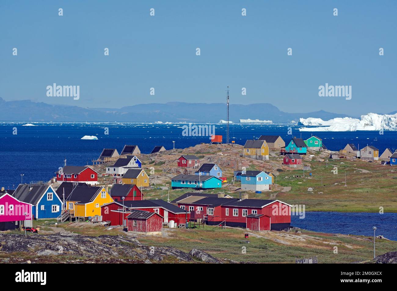 Colourful houses of a small village, big icebergs, Illimanaq, Disko Bay