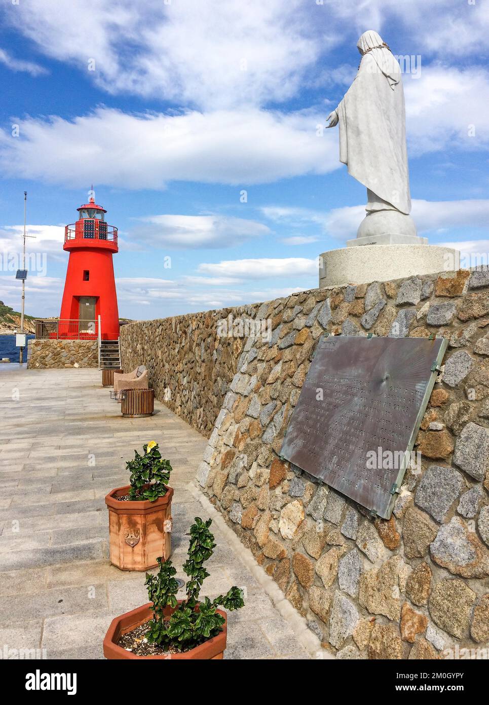 Memorial Monument with memorial plaque on the right for victims of sinking of cruise ship Ship sinking disaster Ship disaster Costa Concordia, above i Stock Photo