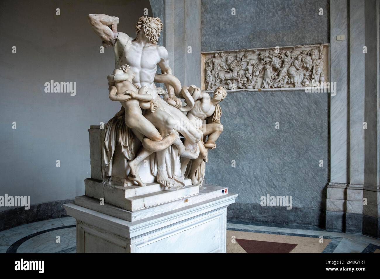 View from half left on historical sculpture in marble Marble sculpture by ancient sculptor Laocoon Group of priest Laocoon and sons fighting battle wi Stock Photo