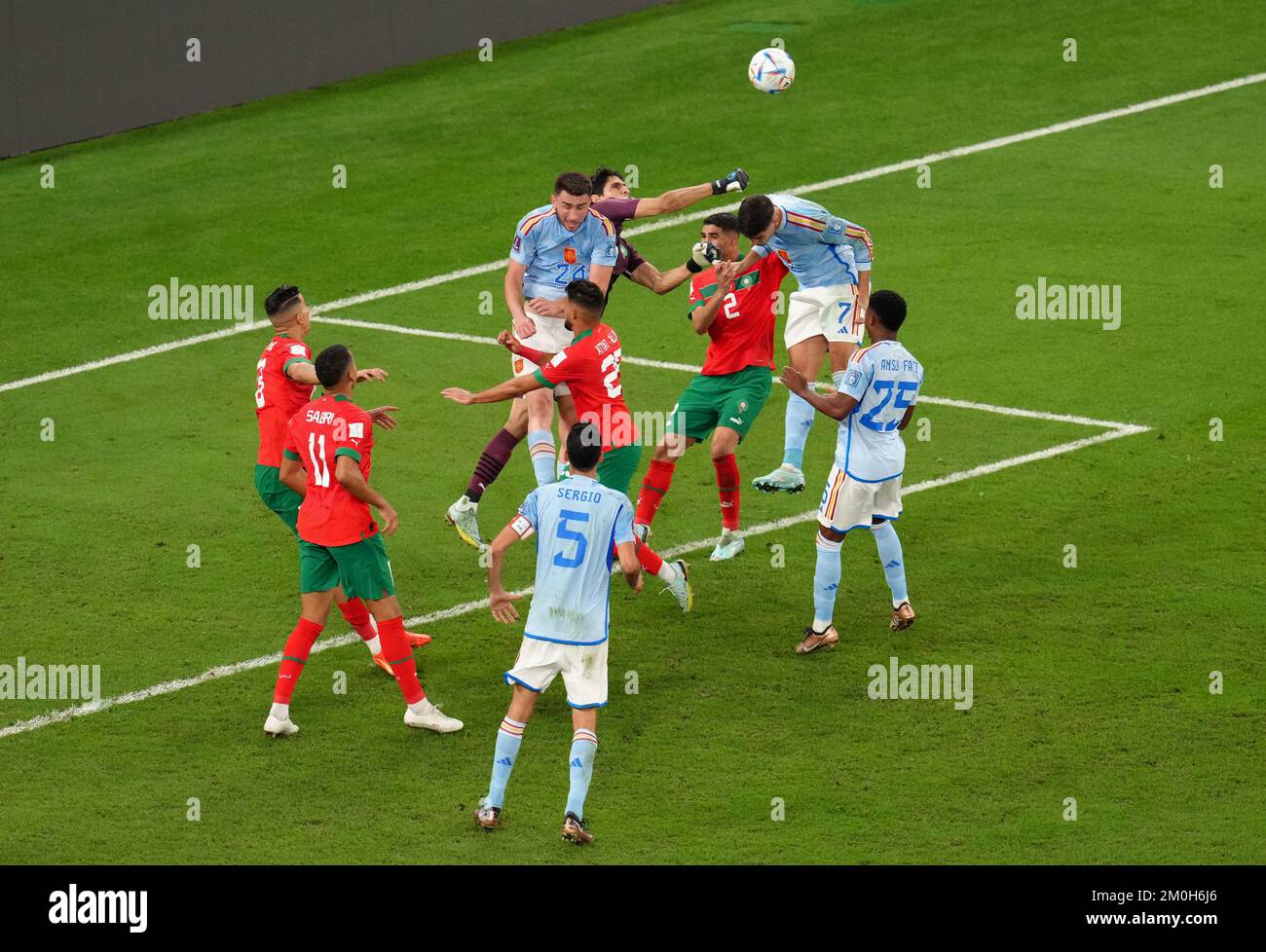 Morocco goalkeeper Yassine Bounou punches clear of Spain's Alvaro Morata during the FIFA World Cup Round of Sixteen match at the Education City Stadium in Al-Rayyan, Qatar. Picture date: Tuesday December 6, 2022. Stock Photo