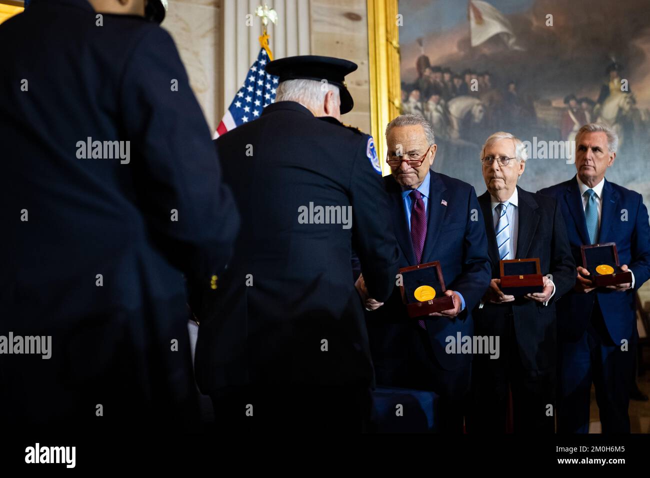 Washington, USA. 06th Dec, 2022. Senator Chuck Schumer (D-N.Y.), the Senate Majority Leader, present medals with Senator Mitch McConnell (R-KY), the Senate Minority Leader, and Representative Kevin McCarthy (R-CA), the House Minority Leader, during a Congressional gold medal ceremony honoring police who served on January 6th, at the U.S. Capitol, in Washington, DC, on Tuesday, December 6, 2022. (Graeme Sloan/Sipa USA) Credit: Sipa USA/Alamy Live News Stock Photo