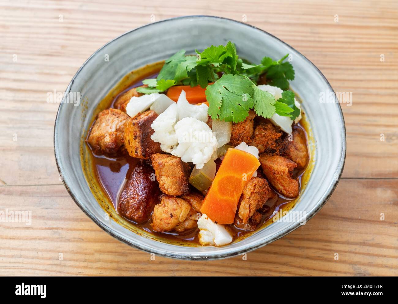 Pica pau traditional portuguese food spicy pork stew dish. Top view in certamic plate Stock Photo