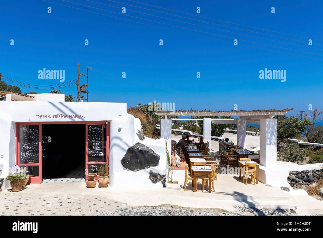 Greece, The Cyclades, Santorini Island (Thera or Thira), village of Fira, Imerovigli, restaurant with shaded terrace Stock Photo