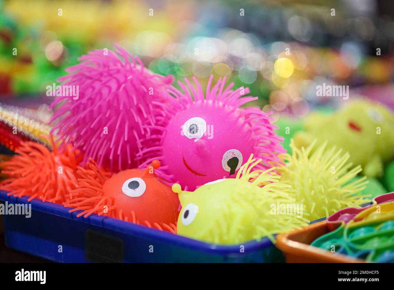 Colorful funny toys hedgehogs in Pink, Yellow, orange color made of rubber or plastic selling in indian fair market Stock Photo