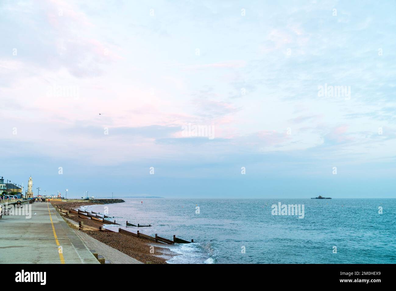 The Deserted Sea Wall And Stone Beach At Herne Bay Seafront On A Early the-deserted-sea-wall-and-stone-beach-at-herne-bay-seafront-on-a-early