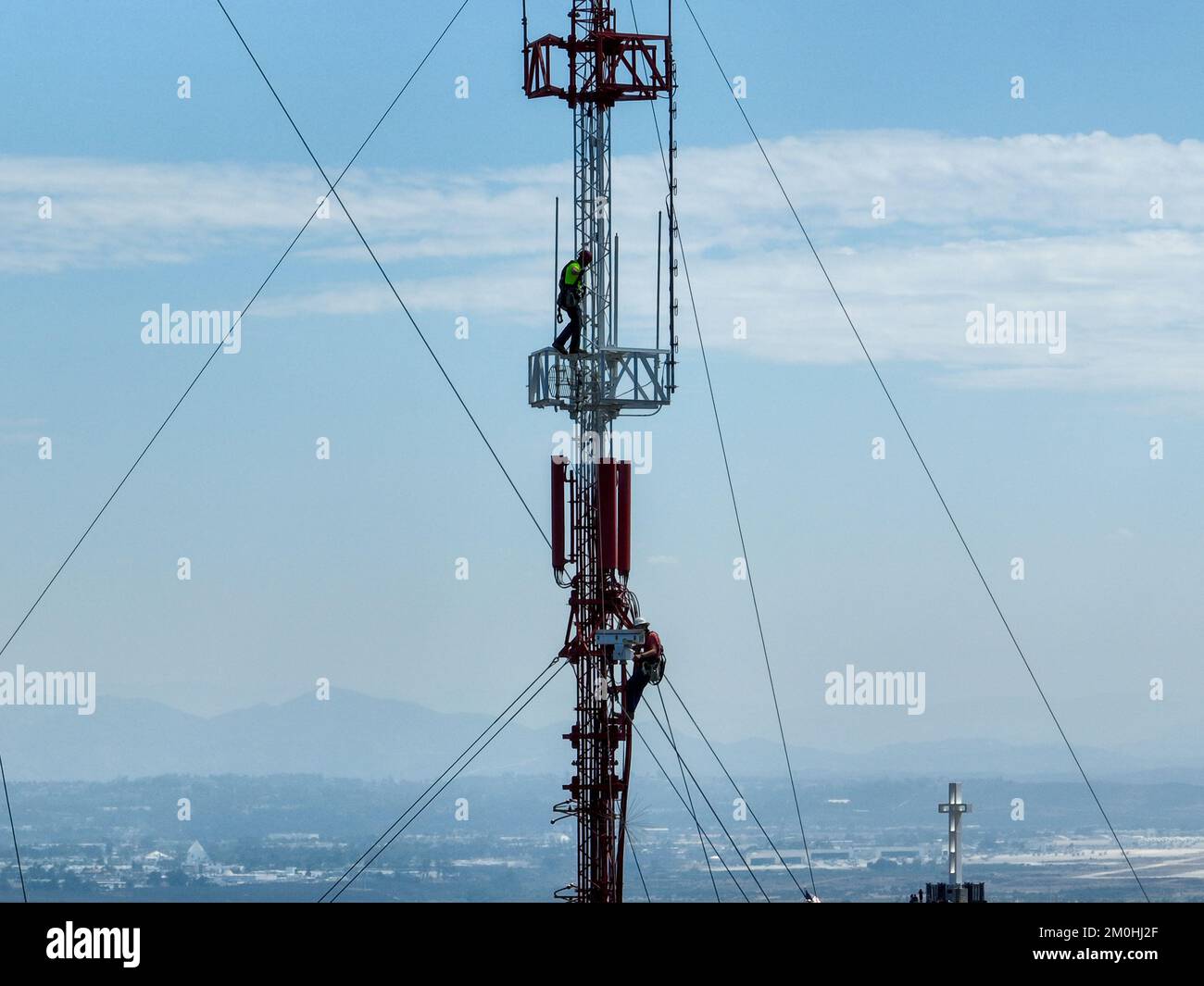 Engineer with safety equipment on high tower for working