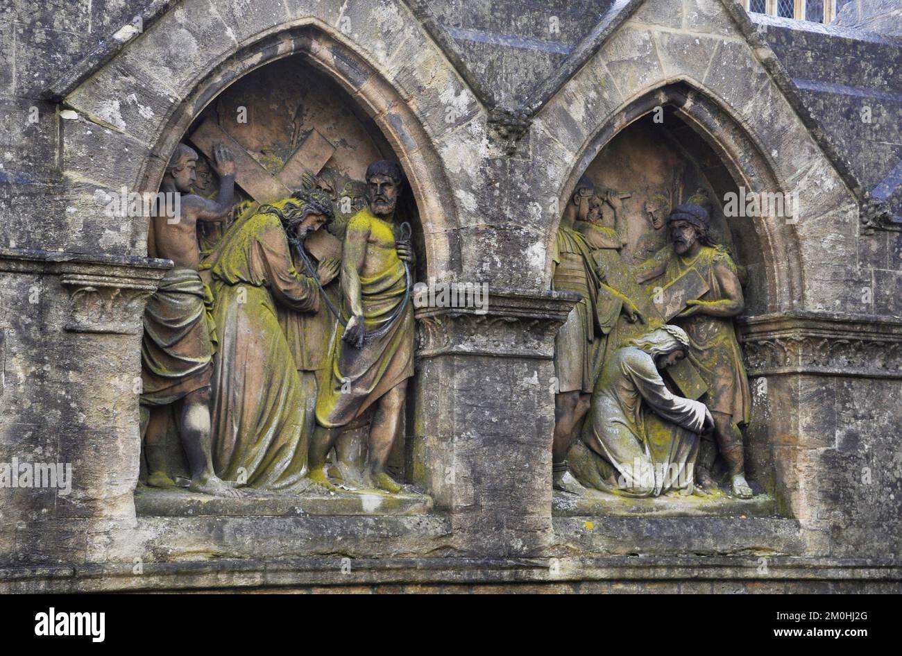 The carved Stations of the Cross outside the church of St John the Baptist in Frome, Somerset. Stock Photo
