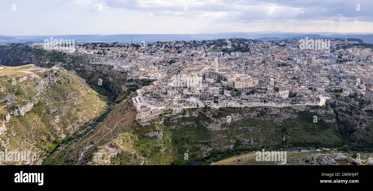 Italy, Basilicata, Matera, The Sassi and the park of the rupestrian churches listed as World Heritage by UNESCO (aerial view) Stock Photo