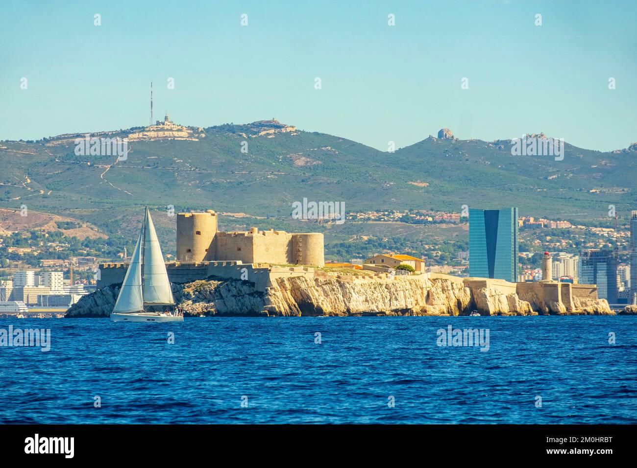 France, Bouches du Rhone, Marseille, the harbour, sailboat in front of the Chateau d'If and the CMA-CGM tower Stock Photo