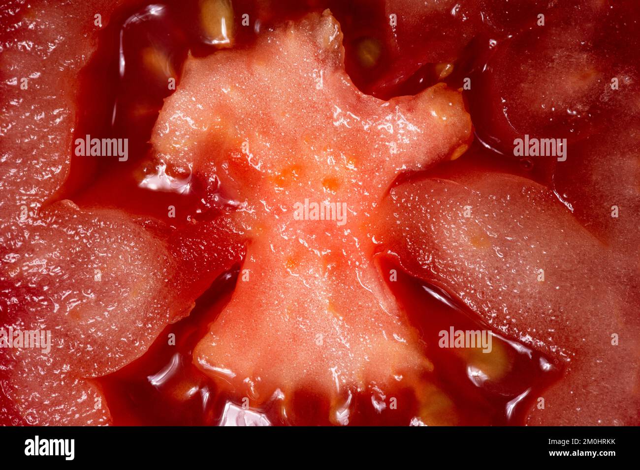Tomato texture as a background. A close up shot of a tomato. Macro photo.tomato Stock Photo