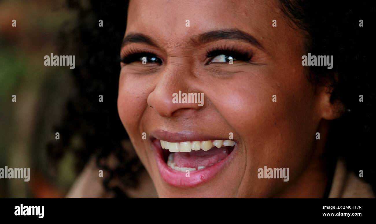 Happy black girl laughing and smiling spontaneously Stock Photo - Alamy