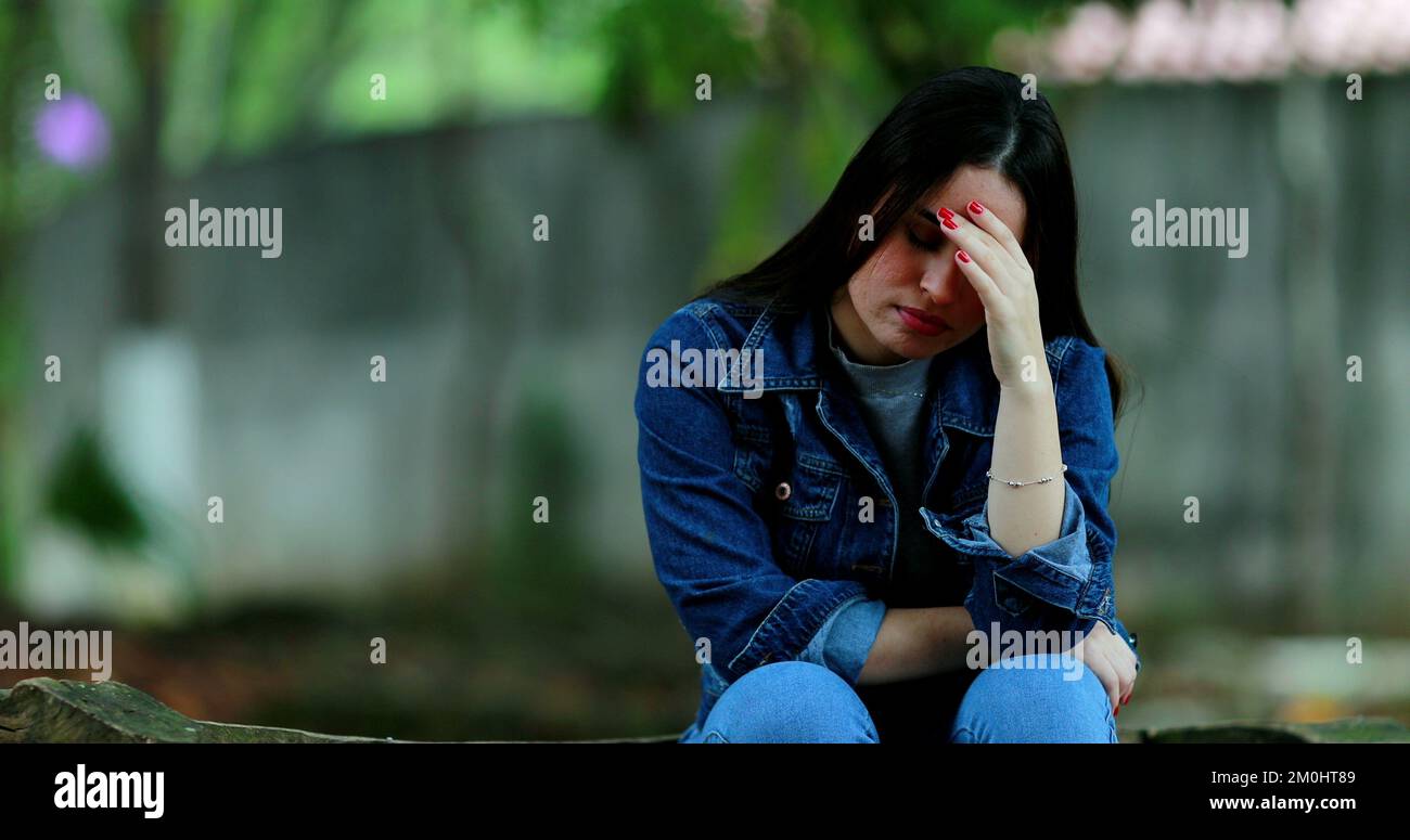 Frustrated young woman feeling regret and bad memories Stock Photo - Alamy