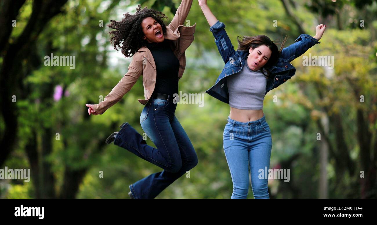 Happy diverse women jump in the air in celebration Stock Photo - Alamy