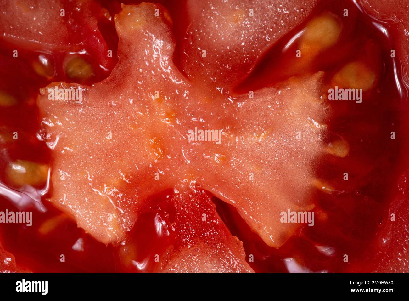 Tomato texture as a background. A close up shot of a tomato. Macro photo.tomato Stock Photo