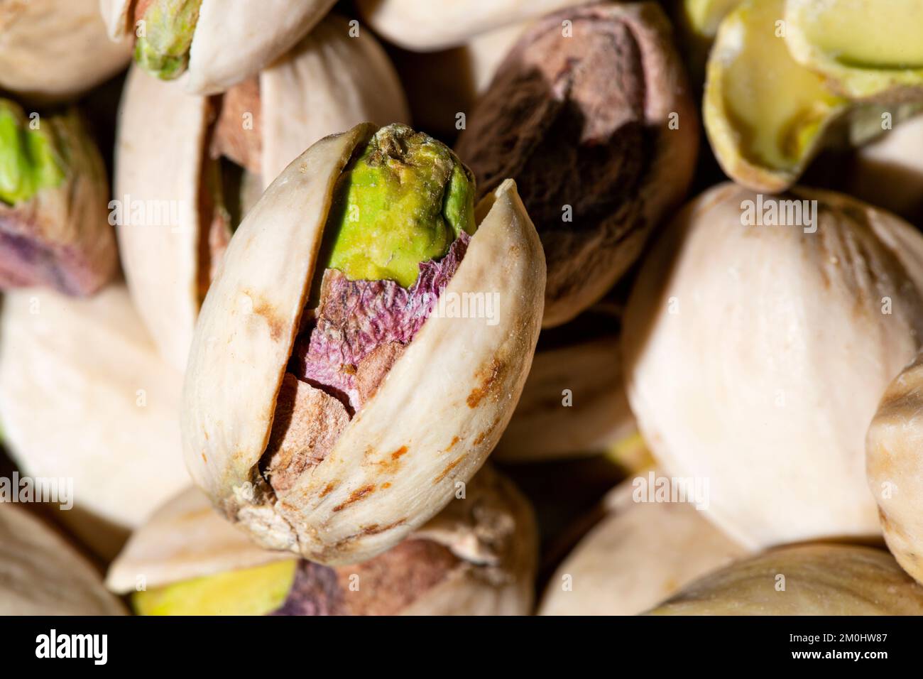 Pistachio texture as background. Close up shot of pistachios. Macro