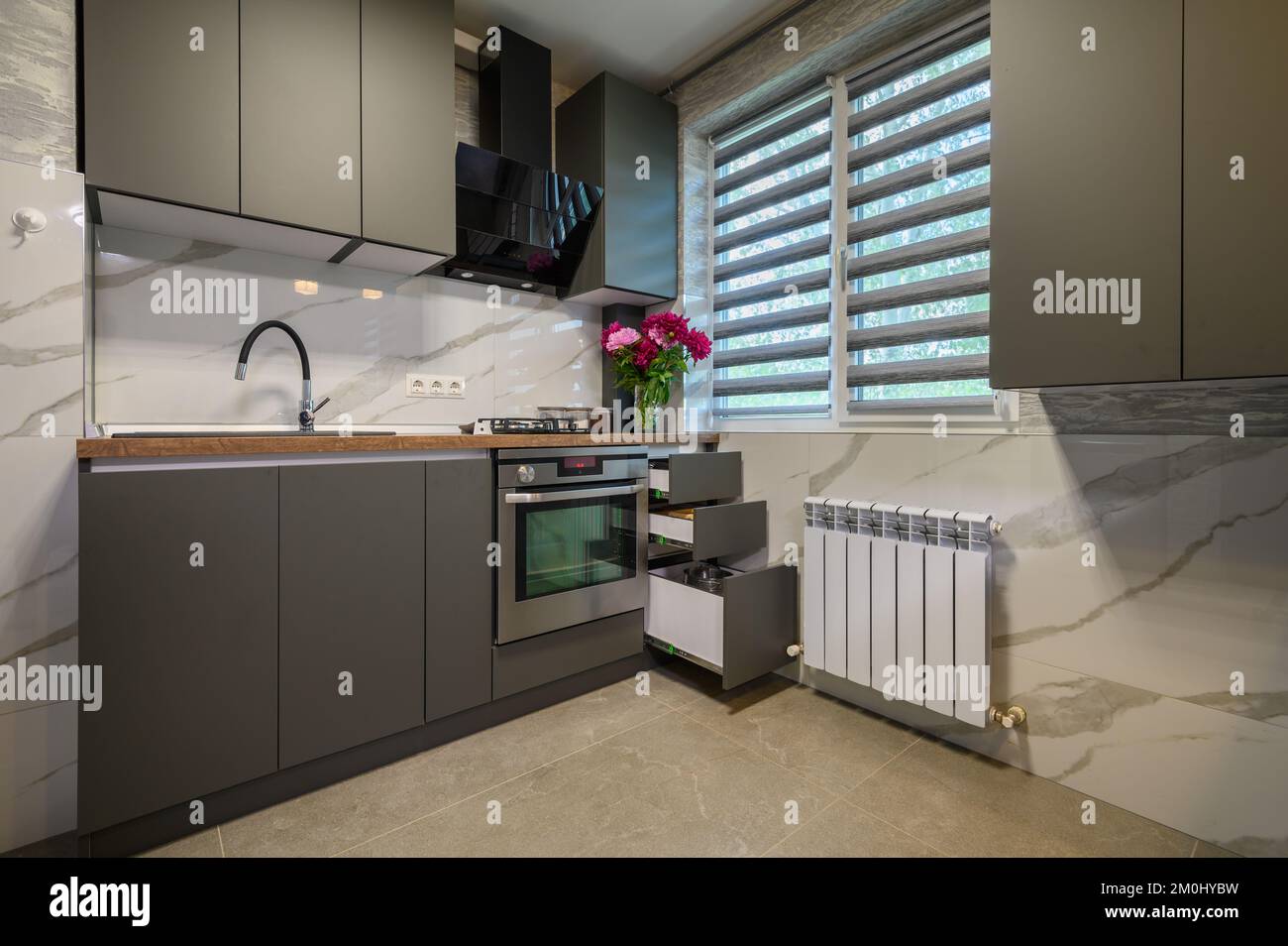 Interior of modern trendy grey kitchen Stock Photo - Alamy