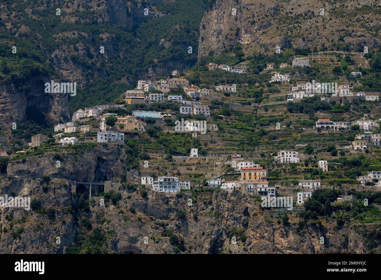 View of the houses and hotels nestled amongst the cliffs of the Amalfi coast. Stock Photo