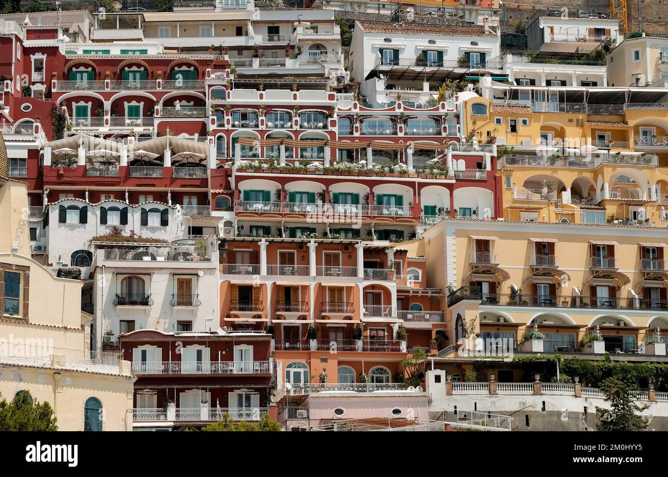 The colourful houses, shops and hotels of Positano layered vertical on ...