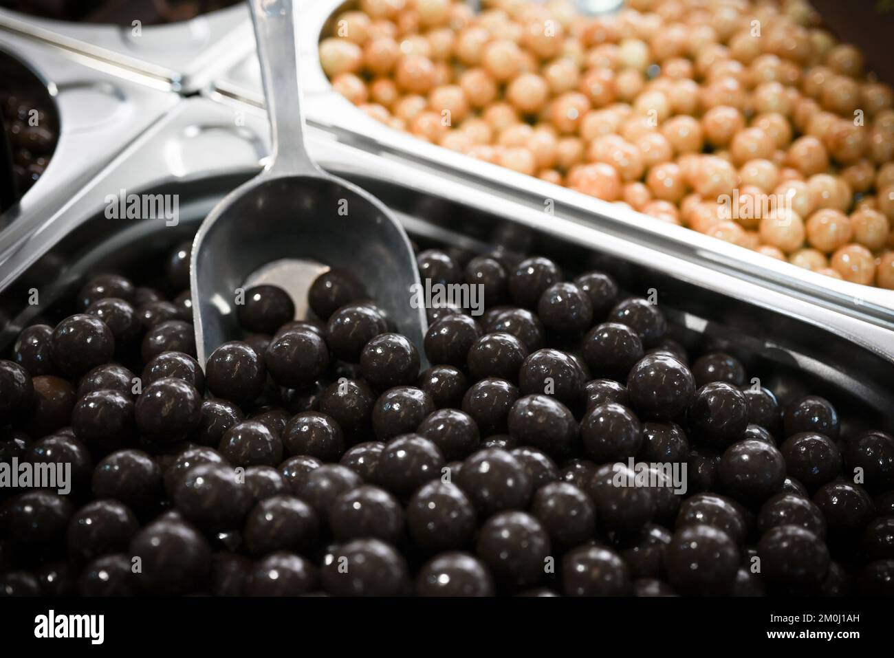 Assorted chocolate pralines arranged in metal boxes for sale Stock Photo
