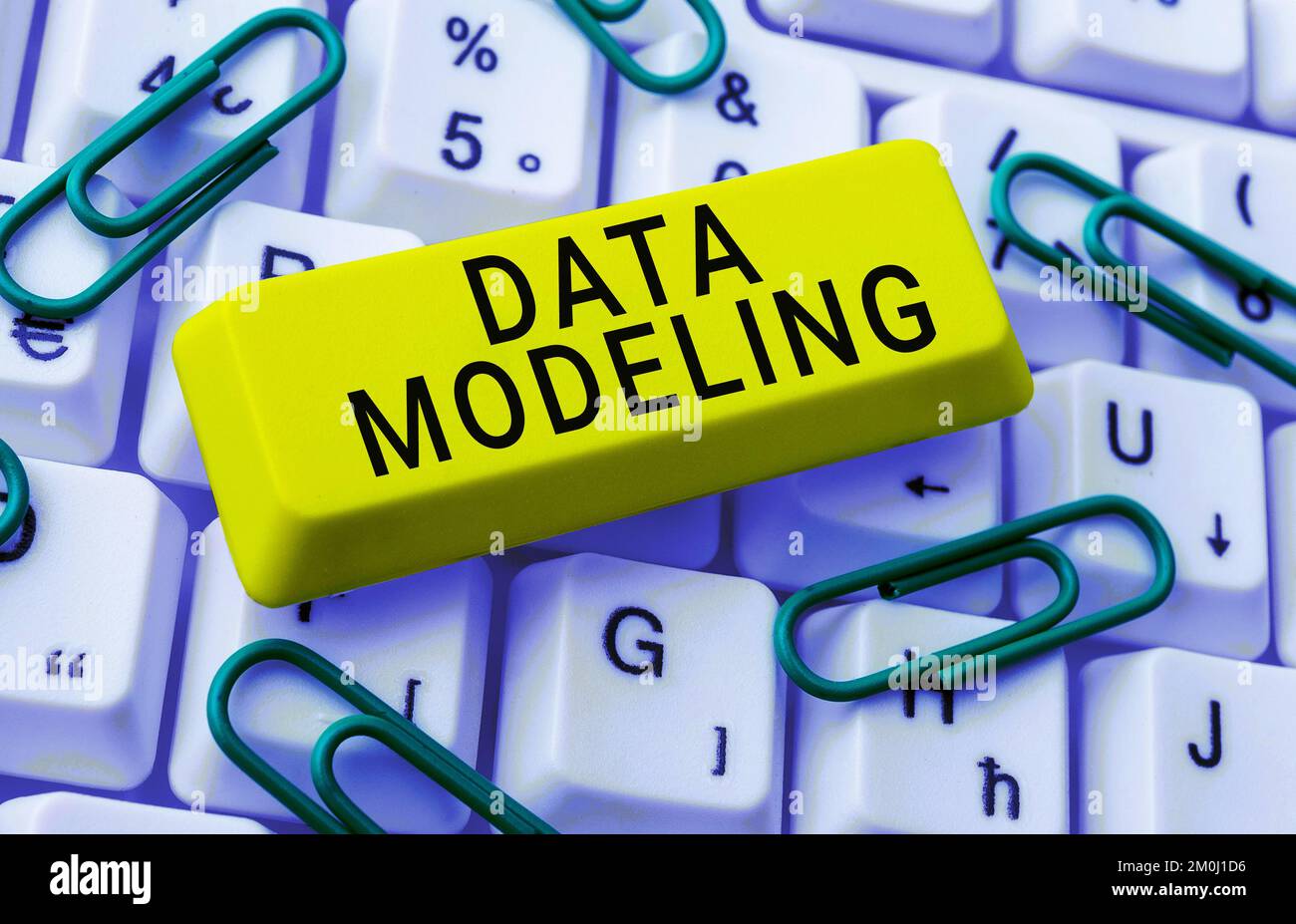 Hand writing sign Data Modeling. Word for process of transferring data between data storage systems Stock Photo