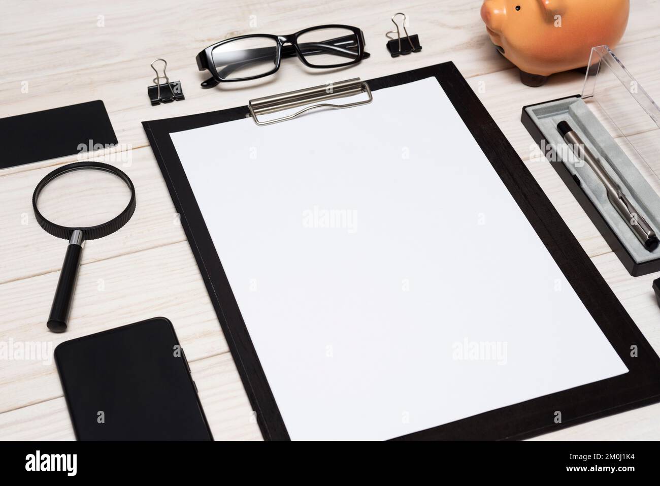 Work from home. Workspace with smartphone, pen, glasses, calculator Stock Photo