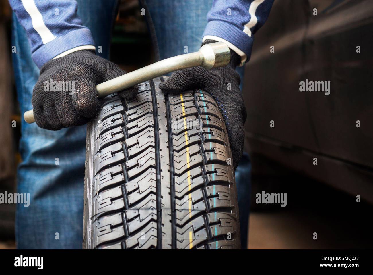 Black male mechanic holding hi-res stock photography and images - Alamy