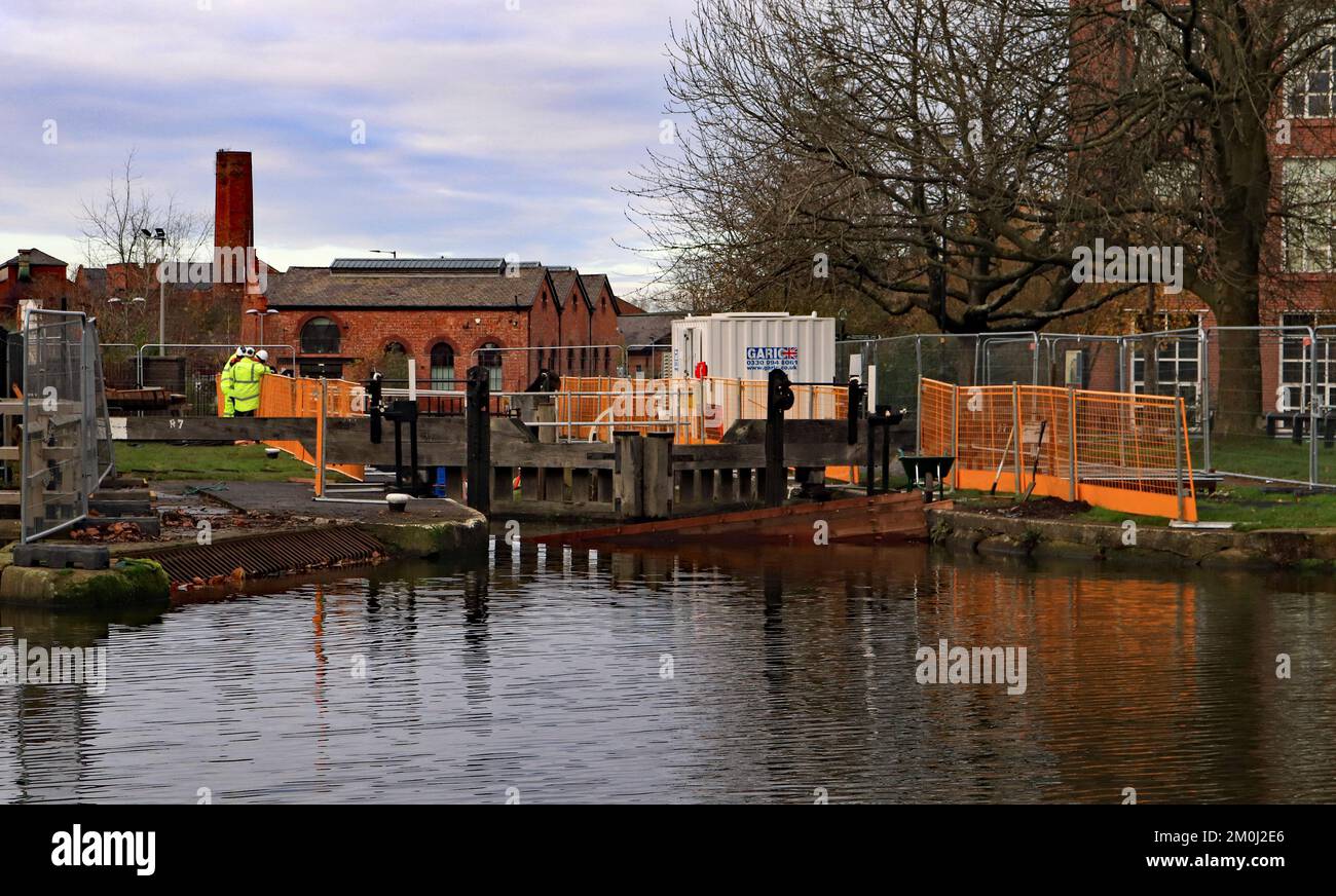 The stop planks and the safety fencing are going into place around lock 87 on the Leeds and Liverpool canal in Wigan for work on the lock gates Stock Photo