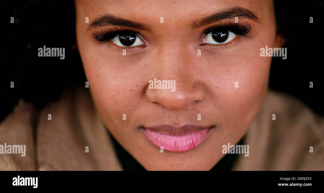 Pensive black African girl close-up face eyes, contemplative Brazilian