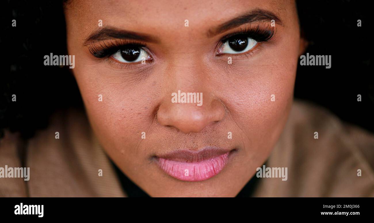 Pensive black African girl close-up face eyes, contemplative Brazilian