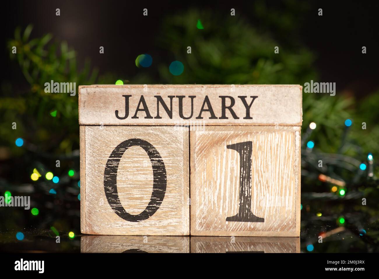 1st january sign for New Year's eve and Christmas tree winter holiday festive background and ornaments Stock Photo