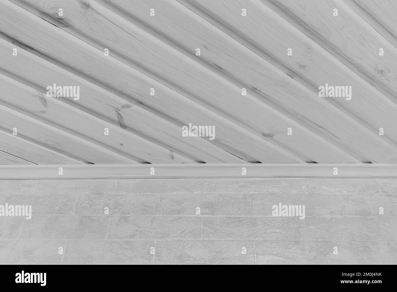 Part of modern interior inside a house with light wood white ceiling