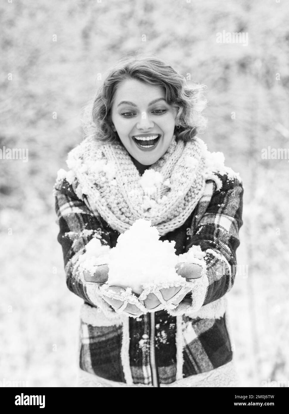 its cold. woman warm clothes in snowy forest. trees covered white snow