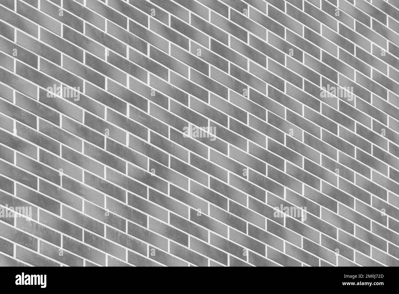 Diagonal, geometric modern dark grey paint brick wall building facade