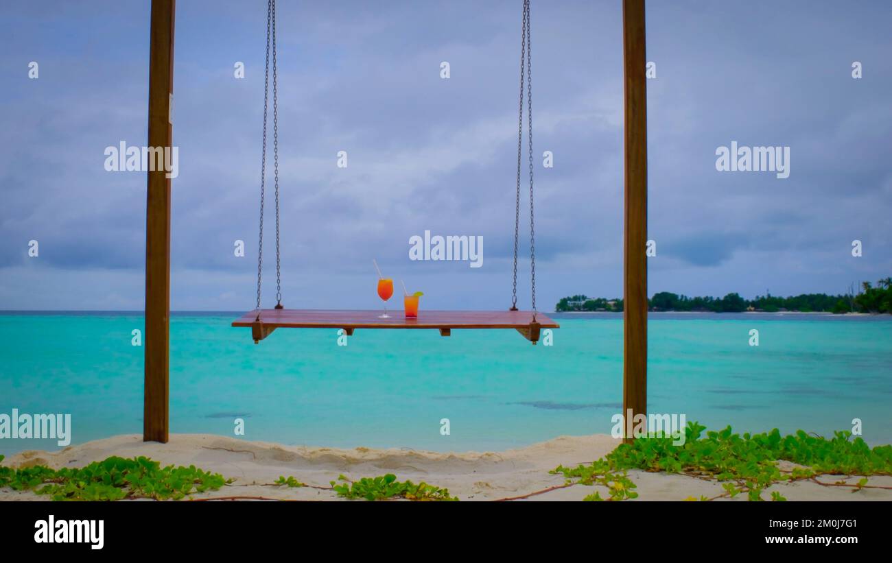 Close up of cocktails on swings. Two drinks is standing Stock Photo Alamy