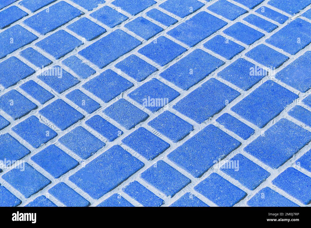 Blue stone paving slabs floor tile urban texture pattern street road background. Stock Photo