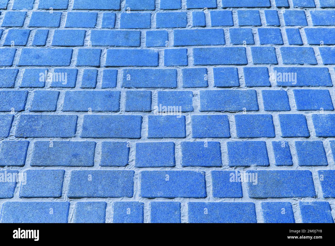 Blue stone paving slabs floor tile urban texture street road background. Stock Photo