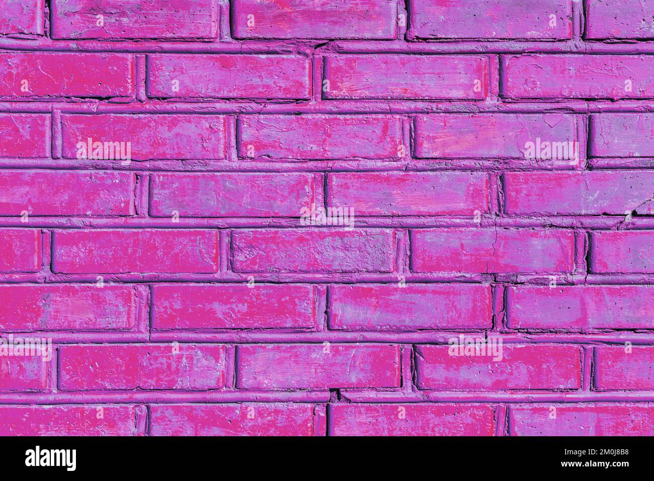 Old purple pink violet color paint brick wall texture background. Stock Photo