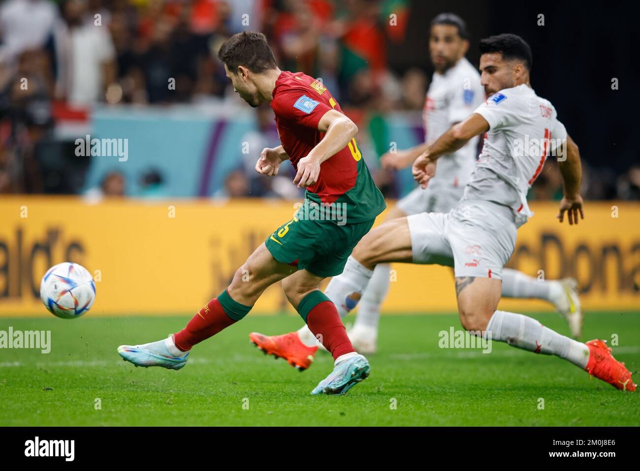 Lusail, Catar. 06th Dec, 2022. RAPHAEL GUERREIRO of Portugal kicks to score his goal during the match between Portugal vs Su? a, valid for the Round of 16 of the World Cup, held at the Lusail National Stadium in Lusail, Qatar. Credit: Rodolfo Buhrer/La Imagem/FotoArena/Alamy Live News Stock Photo