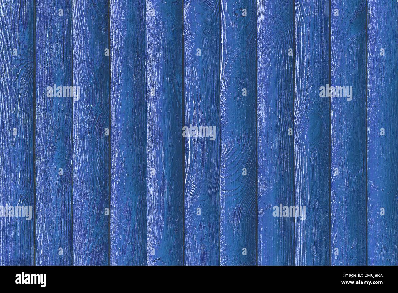 Blue paint on fence boards surface wooden texture plank background. Stock Photo