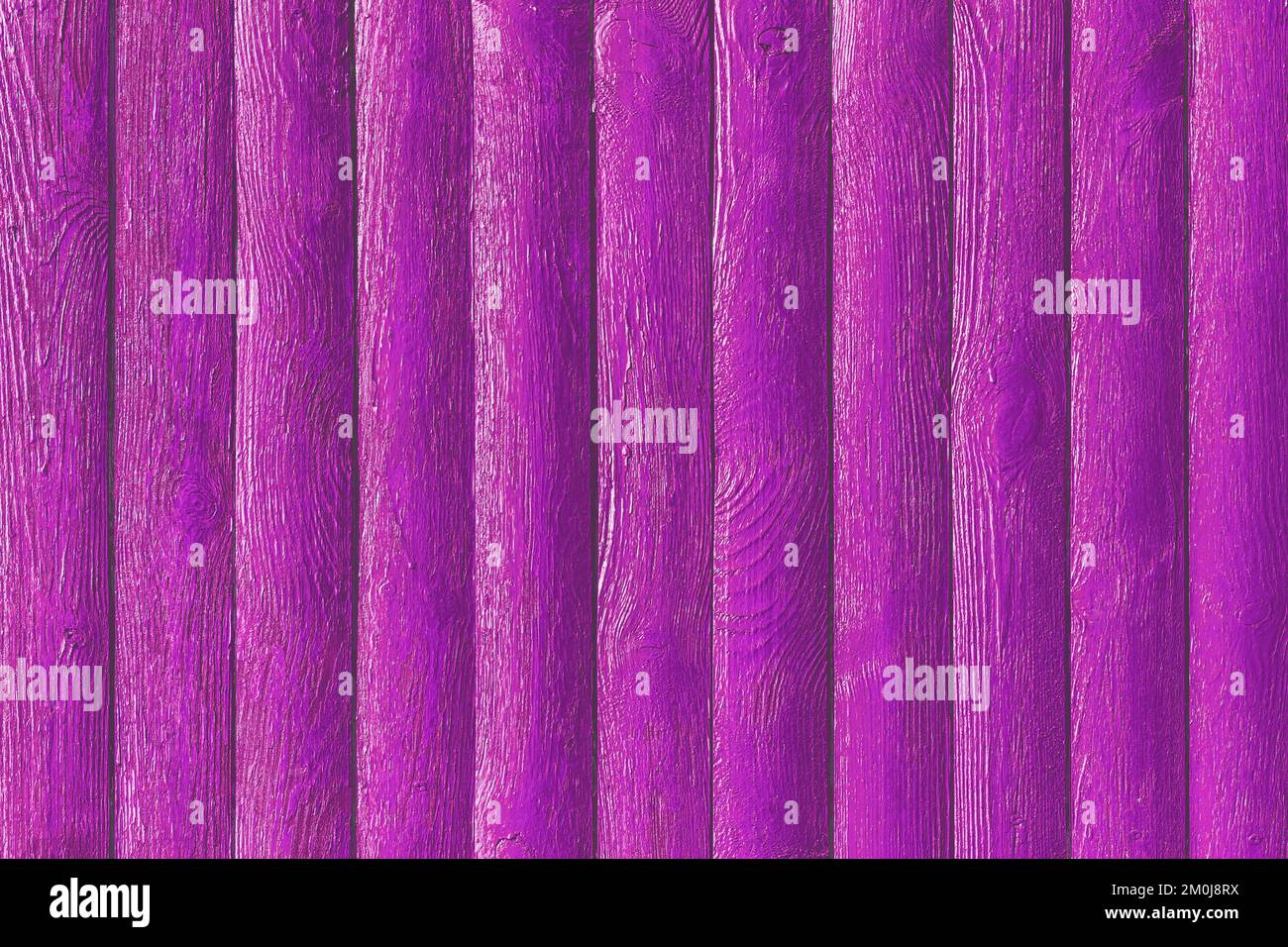 Pink purple paint fence boards surface wooden texture plank background. Stock Photo