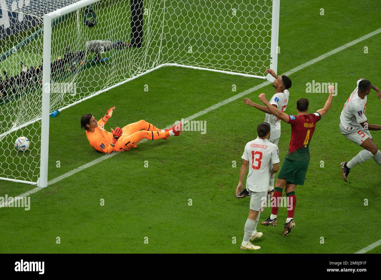 Lusail, Qatar. 6th Dec, 2022. Yann Sommer (1st L), goalkeeper of Switzerland, fails to save the ball during the Round of 16 match between Portugal and Switzerland of the 2022 FIFA World Cup at Lusail Stadium in Lusail, Qatar, Dec. 6, 2022. Credit: Xiao Yijiu/Xinhua/Alamy Live News Stock Photo
