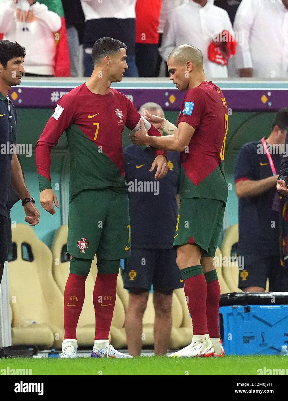 Portugal's Pepe gives the captain's armband to Portugal's Cristiano Ronaldo as he leaves the field of play during the FIFA World Cup Round of Sixteen match at the Lusail Stadium in Lusail, Qatar. Picture date: Tuesday December 6, 2022. Stock Photo