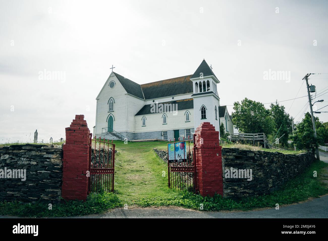 Old St. George's Church, Brigus, Newfoundland. Church on hill framed by Red gate posts - sep 2022. High quality photo Stock Photo