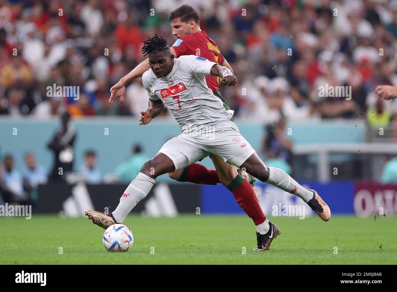Ruben Dias of Portugal and Breel Embolo of Switzerland in action during ...