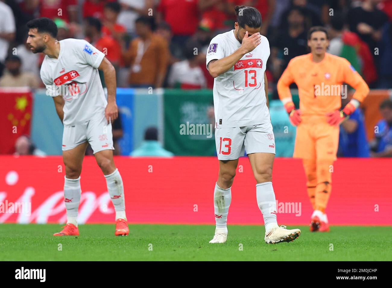 Lusail, Qatar. 06th Dec, 2022. Soccer, 2022 World Cup in Qatar, Portugal - Switzerland, Round of 16, at Lusail Stadium, Ricardo Rodriguez (M), Eray Cömert (l) and goalkeeper Yann Sommer of Switzerland gesture after conceding a goal. Credit: Tom Weller/dpa/Alamy Live News Stock Photo