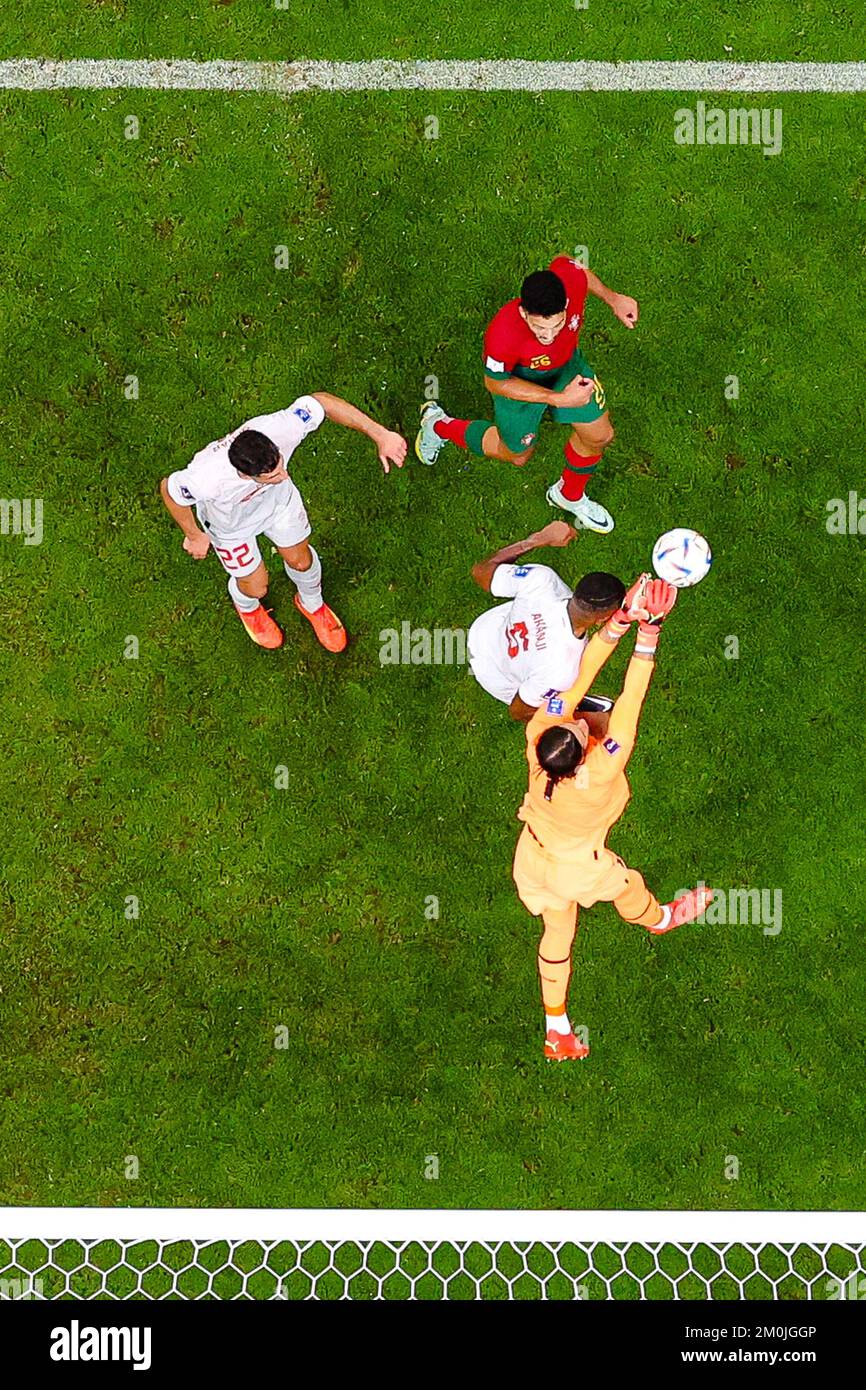 Lusail, Qatar. 6th Dec, 2022. Yann Sommer (bottom), goalkeeper of Switzerland, makes a save during the Round of 16 match between Portugal and Switzerland of the 2022 FIFA World Cup at Lusail Stadium in Lusail, Qatar, Dec. 6, 2022. Credit: Xiao Yijiu/Xinhua/Alamy Live News Stock Photo