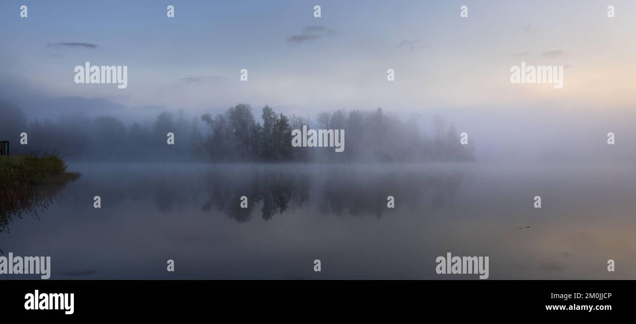 A misty sunrise on Loretta Lake in northern Wisconsin Stock Photo Alamy